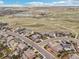 Community aerial showcasing well-maintained homes, landscaping, and scenic open space at 13960 Box Turtle Loop, Parker, CO 80134