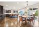 Bright dining area seamlessly flows into a modern kitchen with stainless steel appliances at 13960 Box Turtle Loop, Parker, CO 80134
