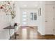 Bright entryway features hardwood floors, white walls, and decorative accents at 13960 Box Turtle Loop, Parker, CO 80134