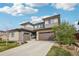 Beautifully landscaped two-story home featuring a modern design and a two-car garage at 13960 Box Turtle Loop, Parker, CO 80134