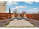 A cozy outdoor fire pit with seating and landscaping for relaxing evenings in the backyard at 13960 Box Turtle Loop, Parker, CO 80134