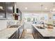 Modern kitchen with granite countertops opens to living room at 13960 Box Turtle Loop, Parker, CO 80134