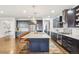 Spacious kitchen with large island, granite countertops, and stainless steel appliances at 13960 Box Turtle Loop, Parker, CO 80134