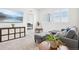 Bright living room with a comfortable gray sofa and TV at 13960 Box Turtle Loop, Parker, CO 80134