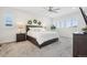 Bright main bedroom with carpet, ceiling fan, and plenty of natural light at 13960 Box Turtle Loop, Parker, CO 80134