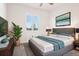 Bright main bedroom features a comfortable king-sized bed and modern decor at 13960 Box Turtle Loop, Parker, CO 80134