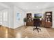Home office features hardwood floors and a large window for ample natural light at 13960 Box Turtle Loop, Parker, CO 80134