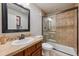 Bathroom with tile shower, vanity, and updated fixtures creating a relaxing and functional space at 10660 Weathersfield Ct, Highlands Ranch, CO 80129