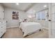 Bright bedroom with window, neutral colors, and closet space, providing a serene retreat at 10660 Weathersfield Ct, Highlands Ranch, CO 80129