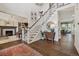 Grand entryway with a staircase, hardwood floors, and views into the formal dining and living rooms at 10660 Weathersfield Ct, Highlands Ranch, CO 80129