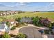 Aerial view of a home's exterior highlighting its curb appeal, landscaping, and location in a Gathering-friendly neighborhood at 10660 Weathersfield Ct, Highlands Ranch, CO 80129