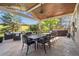 Expansive covered patio with a ceiling fan, full dining set and outdoor living room, perfect for relaxing and entertaining at 10660 Weathersfield Ct, Highlands Ranch, CO 80129