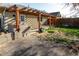 Backyard featuring a wood pergola, concrete patio, and grass space ready for Gathering gatherings at 4595 S Lincoln St, Englewood, CO 80113