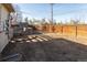 Spacious backyard with dirt, a wooden fence, and a concrete block structure, offering potential for landscaping at 4595 S Lincoln St, Englewood, CO 80113