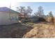 Large backyard featuring a wooden fence, concrete block structure, storage shed and wood pergola at 4595 S Lincoln St, Englewood, CO 80113