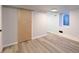 Finished basement area with closet, window, and neutral paint throughout at 4595 S Lincoln St, Englewood, CO 80113