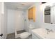 Nicely remodeled bathroom with walk-in tile shower, toilet, and sink with vanity and updated fixtures at 4595 S Lincoln St, Englewood, CO 80113