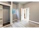 Neutral bedroom with a private bathroom and open closet for storage at 4595 S Lincoln St, Englewood, CO 80113