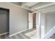 Bright bedroom features neutral paint, white trim, and a convenient closet for storage at 4595 S Lincoln St, Englewood, CO 80113