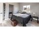 Bedroom features natural light, grey paint, hardwood floors, and closet access at 4595 S Lincoln St, Englewood, CO 80113