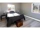Cozy bedroom with natural light, hardwood floors, and views of the neighborhood at 4595 S Lincoln St, Englewood, CO 80113