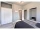Bedroom includes closet with double doors, hardwood floors, and neutral paint at 4595 S Lincoln St, Englewood, CO 80113