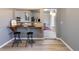 Inviting dining area with a built-in counter, seating, and a stylish, modern aesthetic at 4595 S Lincoln St, Englewood, CO 80113