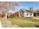 Landscaped single Gathering home with solar panels and mature trees at 4595 S Lincoln St, Englewood, CO 80113