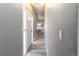 Hallway with hardwood floors, neutral paint, and natural light from the front door at 4595 S Lincoln St, Englewood, CO 80113