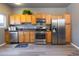 Updated kitchen with stainless steel appliances, granite countertops, and ample cabinet space at 4595 S Lincoln St, Englewood, CO 80113