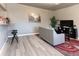 Spacious living room with luxury vinyl flooring, a breakfast bar, and a modern design at 4595 S Lincoln St, Englewood, CO 80113