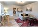 Cozy living room with hardwood floors, and a view of the kitchen through the open doorway at 4595 S Lincoln St, Englewood, CO 80113