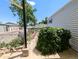 Cozy backyard featuring greenery, rock features, and concrete patio at 2032 Tulane St, Denver, CO 80260