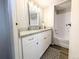 Modern bathroom with vanity, granite countertop, and shower-tub combo at 2032 Tulane St, Denver, CO 80260