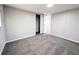 Bedroom boasts neutral carpet and paint and ample closet space at 2032 Tulane St, Denver, CO 80260