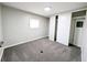 Bedroom with gray carpet, closet with sliding doors, and bright window at 2032 Tulane St, Denver, CO 80260
