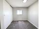Cozy bedroom with carpet, closet space, and natural light at 2032 Tulane St, Denver, CO 80260