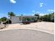 Inviting single-story home with covered parking, well-maintained landscaping, and blue shutters at 2032 Tulane St, Denver, CO 80260