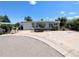 Charming single-story home featuring mature trees, covered parking, and a welcoming entrance at 2032 Tulane St, Denver, CO 80260
