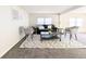Inviting living area featuring a decorative rug and comfortable seating at 2032 Tulane St, Denver, CO 80260