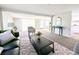 Expansive living space with an open floor plan leading to the dining area and kitchen at 2032 Tulane St, Denver, CO 80260