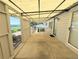 Covered patio featuring concrete floor, privacy walls, and a bright airy space at 2032 Tulane St, Denver, CO 80260