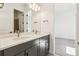 Modern bathroom with double vanity, quartz countertop, and bright lighting at 3884 Freestone Pt, Castle Rock, CO 80108