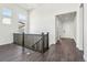 Bright foyer with dark hardwood floors and an open view to the front door at 3884 Freestone Pt, Castle Rock, CO 80108