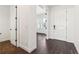 Clean entryway with white trim, hardwood floors, and view of sunlit room at 3884 Freestone Pt, Castle Rock, CO 80108