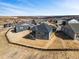An aerial view of a community, with similar-style homes set against a scenic backdrop at 3884 Freestone Pt, Castle Rock, CO 80108