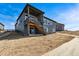 Back exterior of the home featuring a walk out basement and wooden deck with stairs at 3884 Freestone Pt, Castle Rock, CO 80108