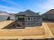 Back exterior of home featuring stairs, a deck and lots of natural light and nearby homes at 3884 Freestone Pt, Castle Rock, CO 80108