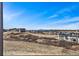 Expansive neighborhood view from a high vantage point on a bright, sunny day at 3884 Freestone Pt, Castle Rock, CO 80108