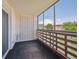 Enclosed balcony, protected from the elements with large floor-to-ceiling windows and geometric patterned wall feature at 635 S Alton Way # 1C, Denver, CO 80247